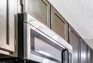 Modern Kitchen with Stainless Steel Appliances and Wood Cabinetry
